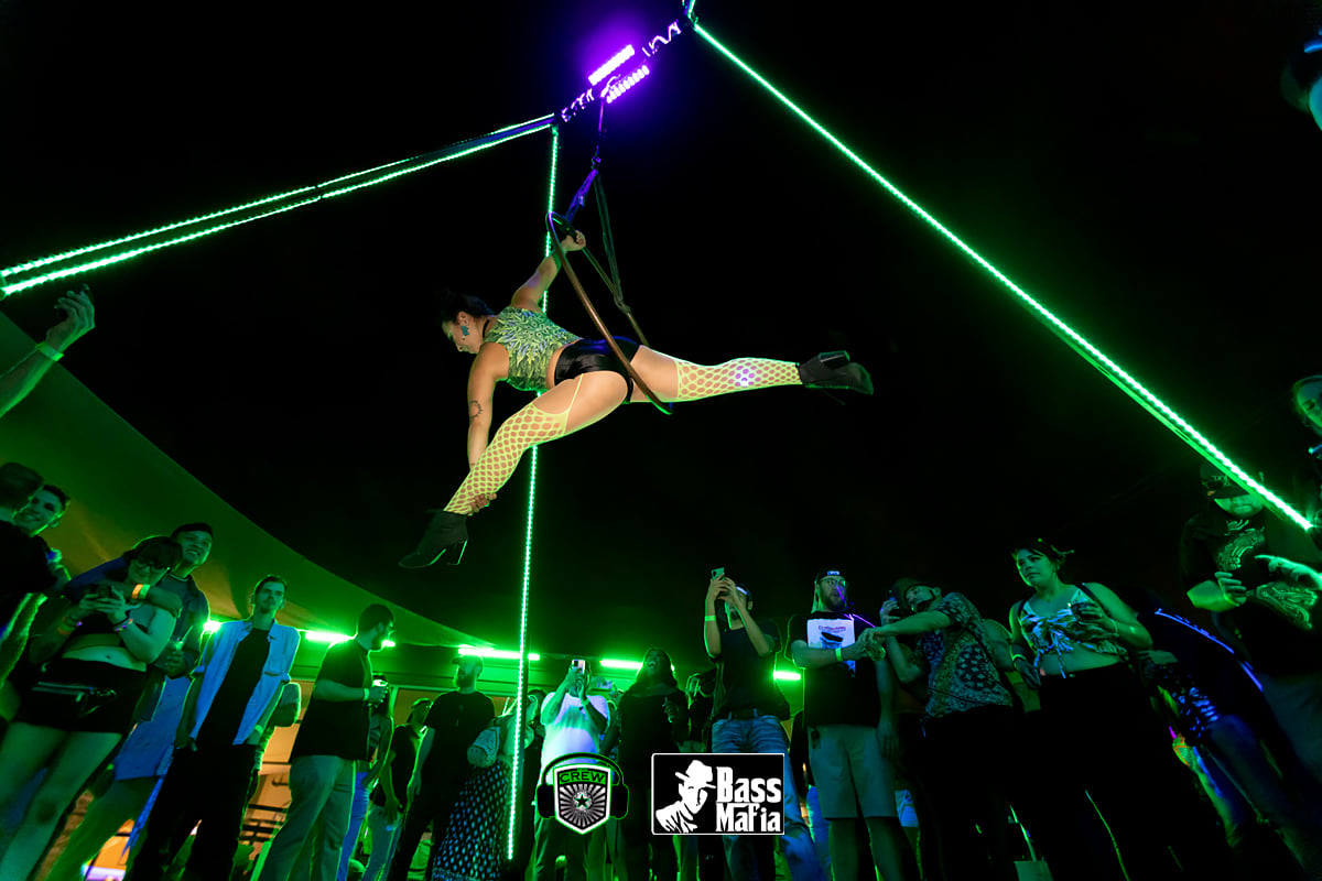 an aerialist in an elevated lyra