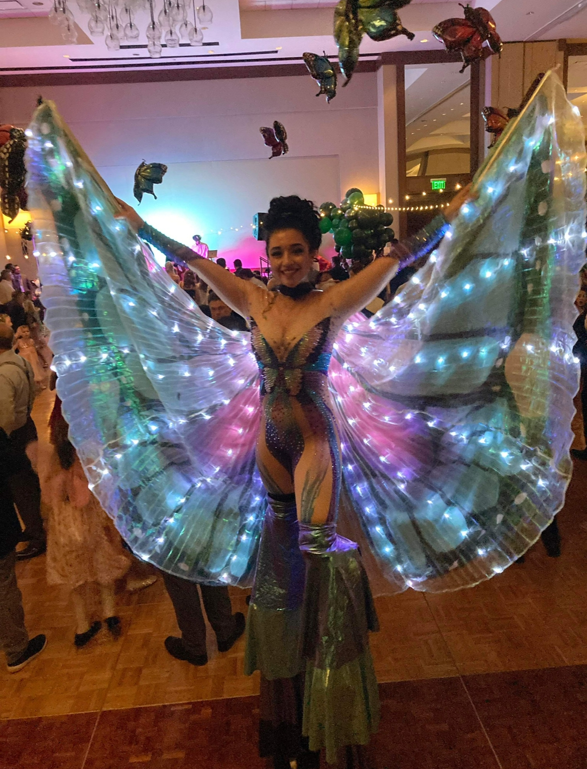 Woman wearing light-up butterfly wings