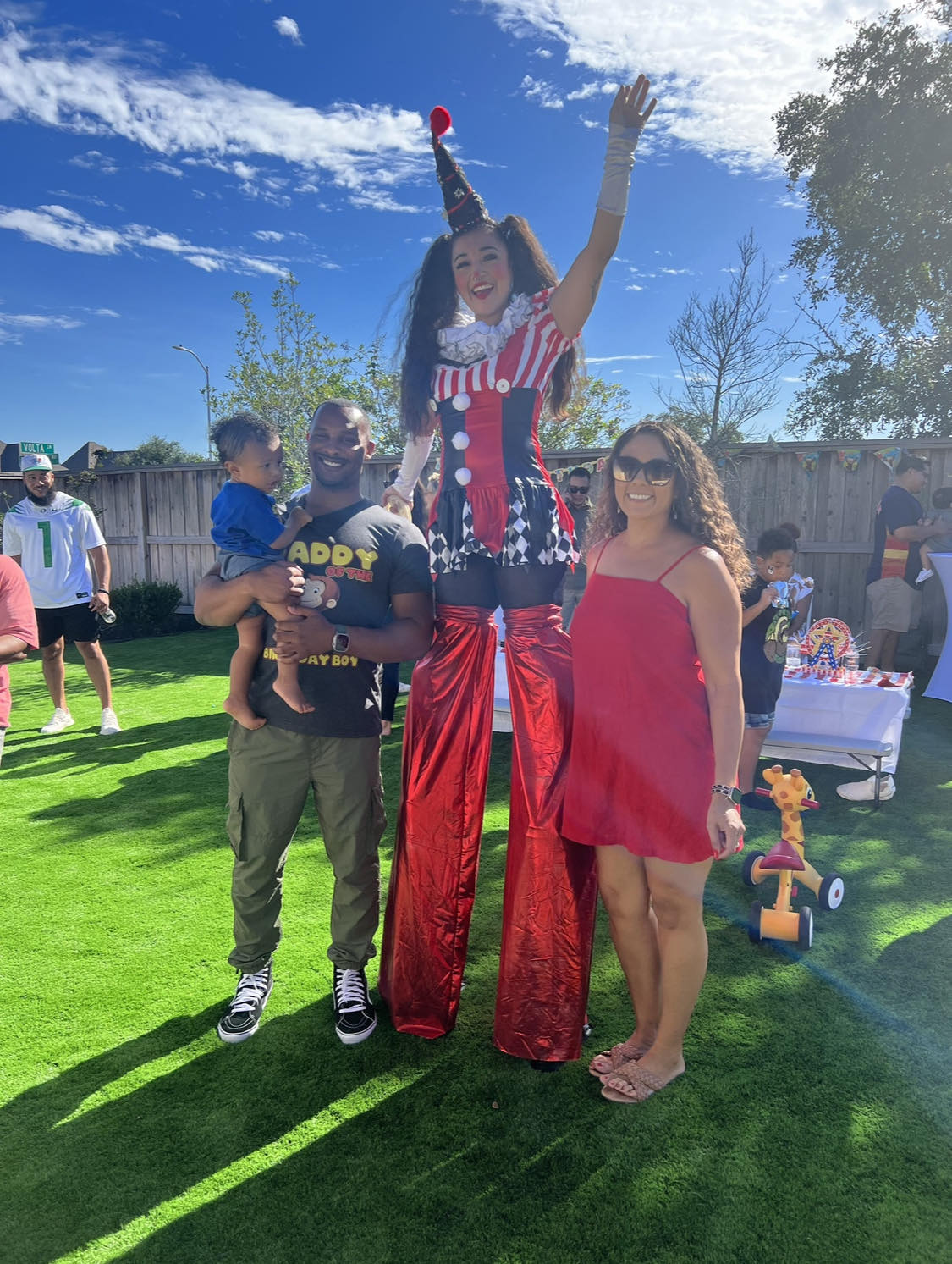 A stilt-walking clown