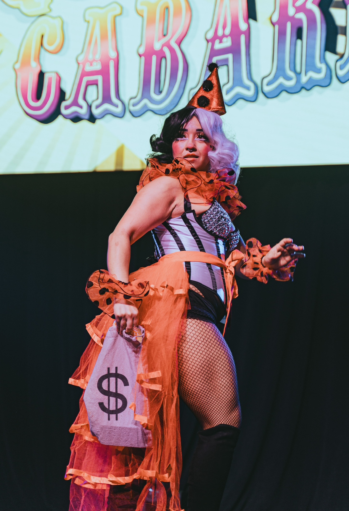 Burlesque dancer dressed as a bank robber